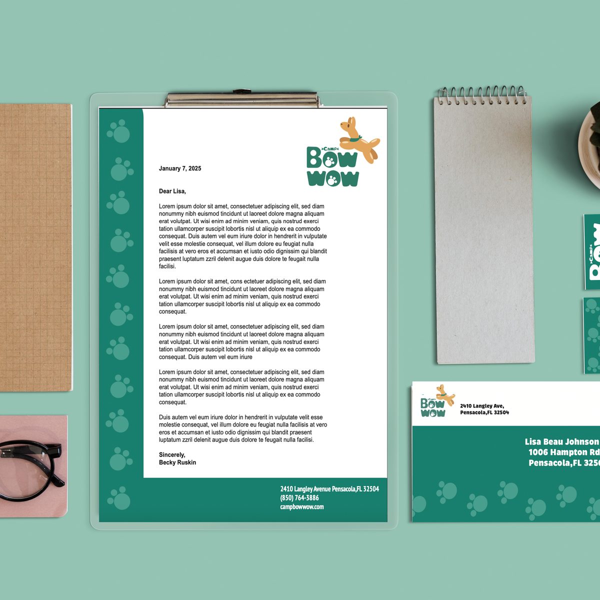 Camp Bow Wow rebrand — stationery and business card flat lay on teal background
